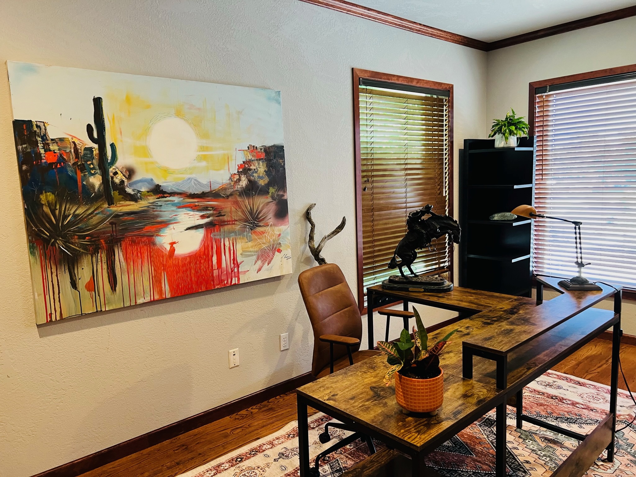 Art-led Southern Oregon office with a colorful desert artwork